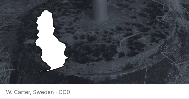 A septic tank access lid and riser, under the outline of Baldwin County. The source names Sweden.
