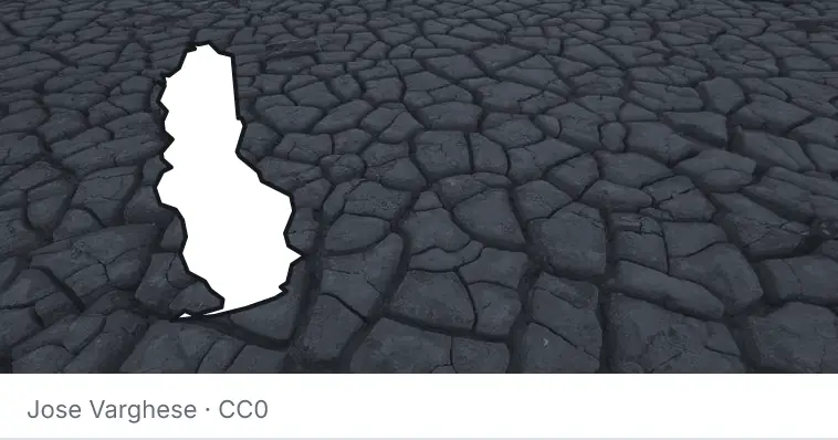 Dried, cracked ground, under the outline of Baldwin County.