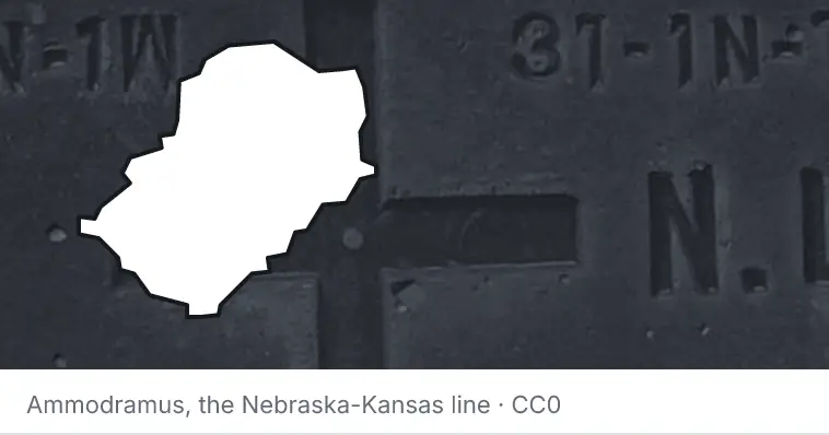 A survey monument's crosshair, under the outline of Jefferson County. The source names the Nebraska-Kansas line.