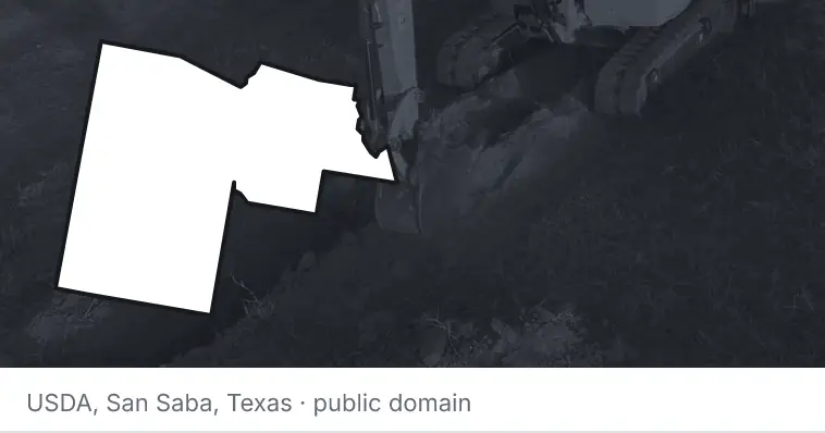 An excavator cutting a trench, under the outline of Maricopa County. The source names San Saba, Texas.