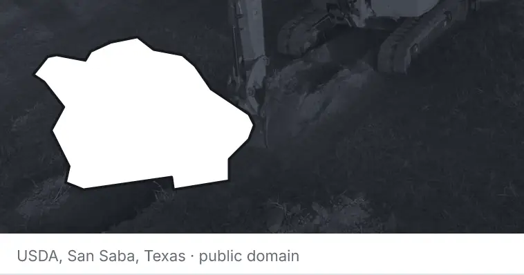 An excavator cutting a trench, under the outline of Citrus County. The source names San Saba, Texas.