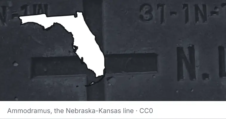 A survey monument's crosshair, under the outline of Florida. The source names the Nebraska-Kansas line.