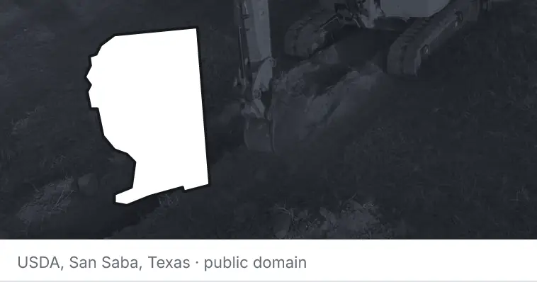 An excavator cutting a trench, under the outline of Santa Rosa County. The source names San Saba, Texas.