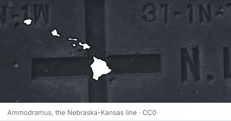 A survey monument's crosshair, under the outline of Hawaii. The source names the Nebraska-Kansas line.