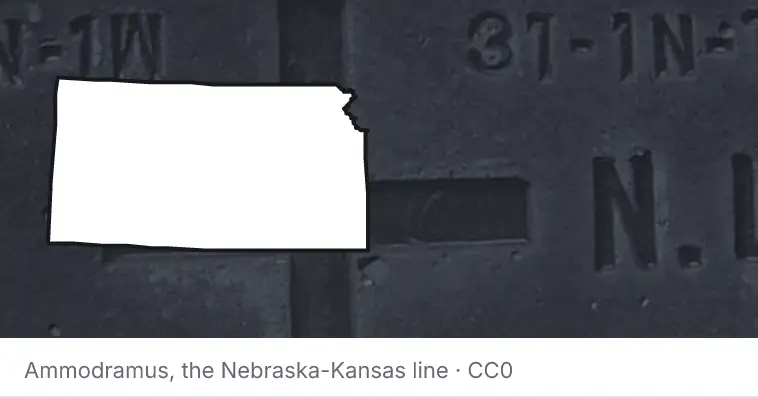 A survey monument's crosshair, under the outline of Kansas. The source names the Nebraska-Kansas line.