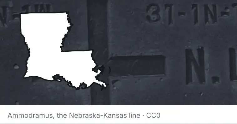 A survey monument's crosshair, under the outline of Louisiana. The source names the Nebraska-Kansas line.