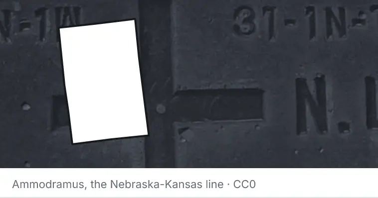 A survey monument's crosshair, under the outline of Kent County. The source names the Nebraska-Kansas line.