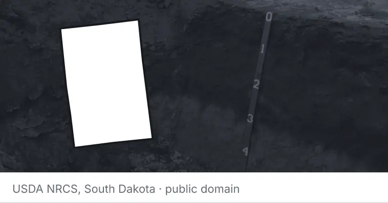 A soil profile in an open pit, under the outline of Kent County. The source names South Dakota.