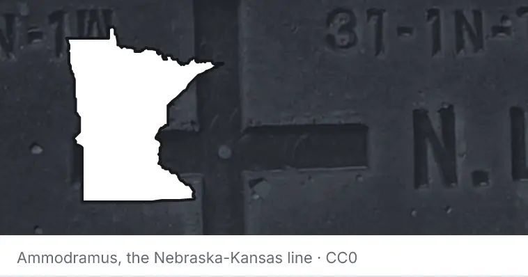 A survey monument's crosshair, under the outline of Minnesota. The source names the Nebraska-Kansas line.