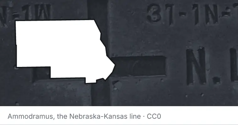 A survey monument's crosshair, under the outline of Stearns County. The source names the Nebraska-Kansas line.