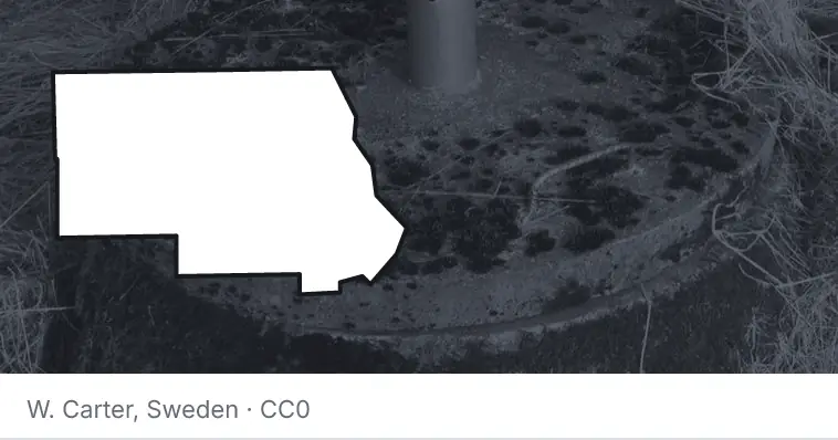A septic tank access lid and riser, under the outline of Stearns County. The source names Sweden.
