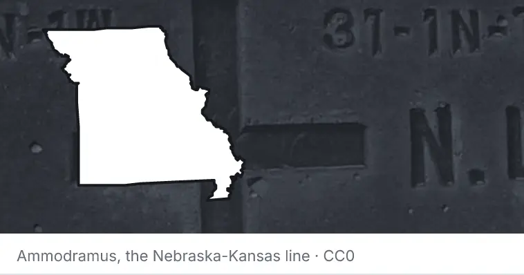 A survey monument's crosshair, under the outline of Missouri. The source names the Nebraska-Kansas line.