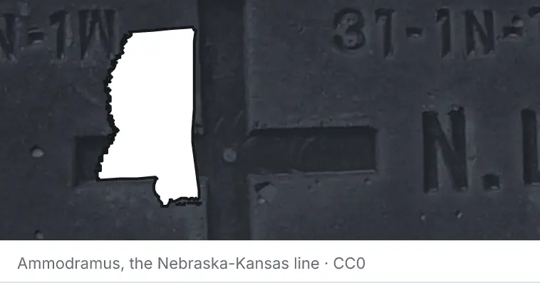 A survey monument's crosshair, under the outline of Mississippi. The source names the Nebraska-Kansas line.