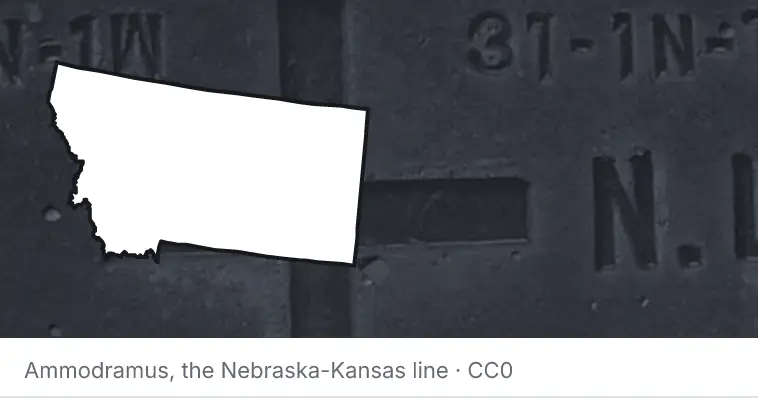 A survey monument's crosshair, under the outline of Montana. The source names the Nebraska-Kansas line.