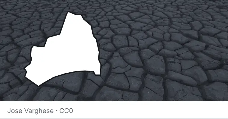 Dried, cracked ground, under the outline of Brunswick County.