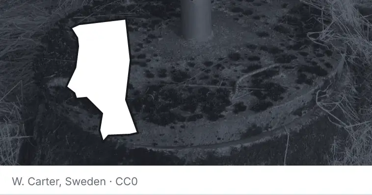 A septic tank access lid and riser, under the outline of Iredell County. The source names Sweden.
