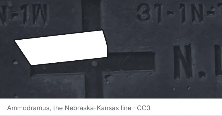 A survey monument's crosshair, under the outline of Lincoln County. The source names the Nebraska-Kansas line.
