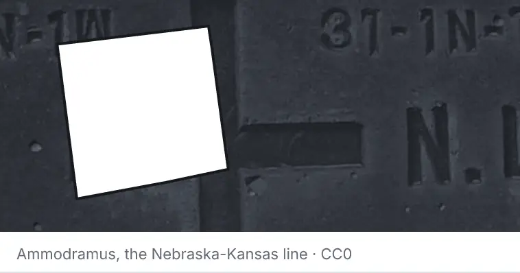 A survey monument's crosshair, under the outline of Randolph County. The source names the Nebraska-Kansas line.