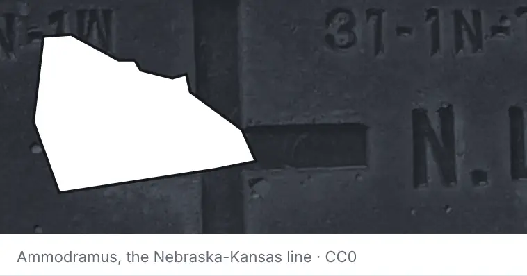 A survey monument's crosshair, under the outline of Rowan County. The source names the Nebraska-Kansas line.