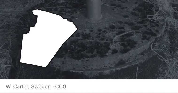 A septic tank access lid and riser, under the outline of Wake County. The source names Sweden.