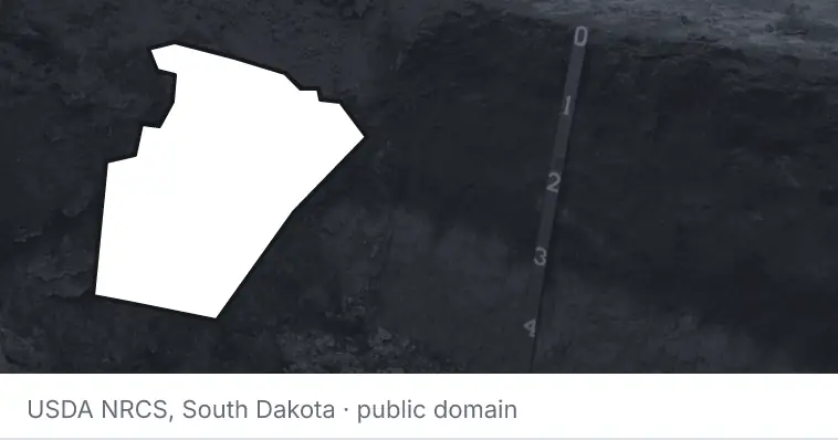 A soil profile in an open pit, under the outline of Wake County. The source names South Dakota.