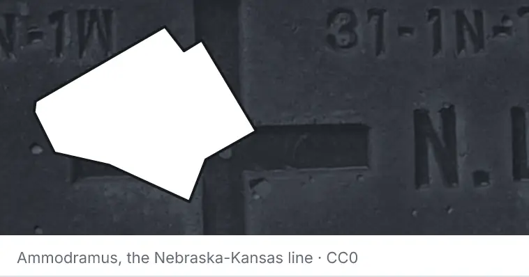 A survey monument's crosshair, under the outline of Bell County. The source names the Nebraska-Kansas line.