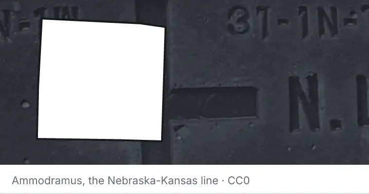 A survey monument's crosshair, under the outline of Denton County. The source names the Nebraska-Kansas line.