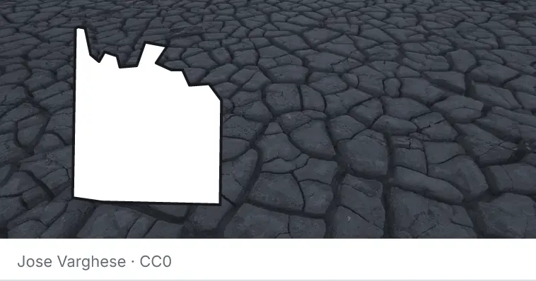 Dried, cracked ground, under the outline of Grayson County.