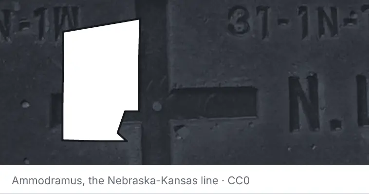 A survey monument's crosshair, under the outline of Hunt County. The source names the Nebraska-Kansas line.