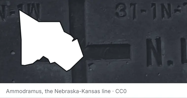 A survey monument's crosshair, under the outline of Montgomery County. The source names the Nebraska-Kansas line.