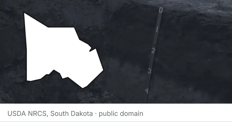 A soil profile in an open pit, under the outline of Montgomery County. The source names South Dakota.