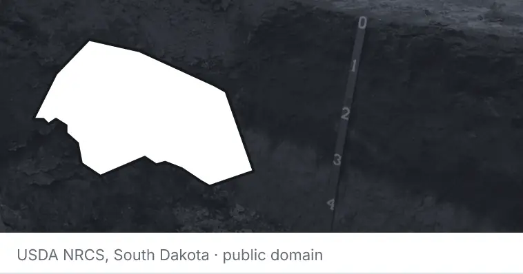 A soil profile in an open pit, under the outline of Williamson County. The source names South Dakota.