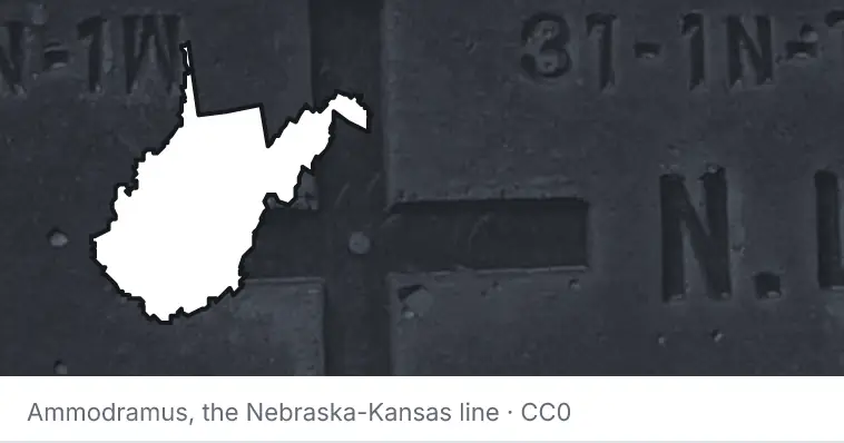 A survey monument's crosshair, under the outline of West Virginia. The source names the Nebraska-Kansas line.
